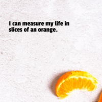 A magazine page that says I can measure my life in slices of an orange.