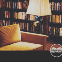 A magazine cover featuring an arm chair next to a lamp and a bookshelf.